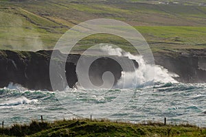 Powerful waves crushing against Cliffs and rough stone coastline of West coast of Ireland. Doolin area. County Clare. Ocean power