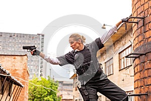 Powerful Woman Holding Gun. War Action Movie Style