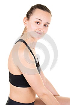 Powerful young fit woman on a white background