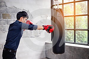 Powerful young man punching you in the face stock photo