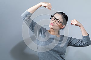 Powerful young woman in success pose