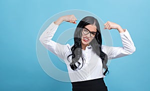 Powerful young woman in success pose