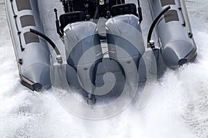 outboard motors on a speed boat photo