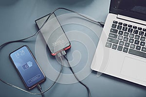 Powerfull power bank charges two devices at one time photo