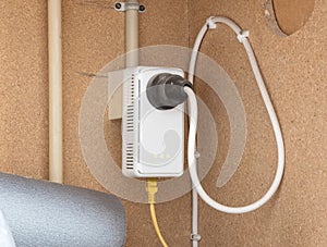 Powerline network adaper plugged into a wall socket