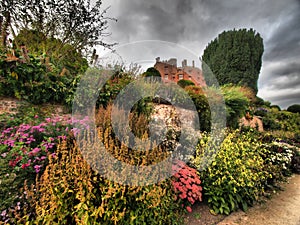 Powys Castle was originally a medieval castle, later rebuilt into a chateau, surrounded by Baroque gardens.