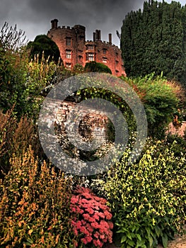 Powys Castle was originally a medieval castle, later rebuilt into a chateau, surrounded by Baroque gardens.