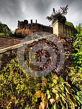 Powys Castle was originally a medieval castle, later rebuilt into a chateau, surrounded by Baroque gardens.