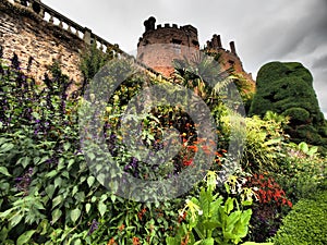 Powys Castle was originally a medieval castle, later rebuilt into a chateau, surrounded by Baroque gardens.