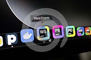 Poznan, Poland â April 14, 2025: macOS Dock interface with cursor selecting WebStorm IDE icon on black background
