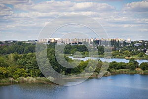 Poznan, Poland - August 08, 2022: View from observation tower Szachty on park, pond and buildings in town Poznan. Relax in