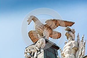 Poznan, Poland - August 09, 2021. Statues on the roof of Kornicka Library - Biblioteka Kornicka in Palac Dzialynskich with protect photo