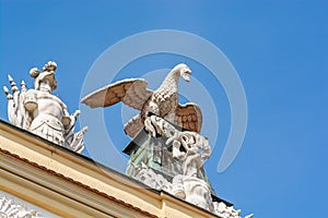 Poznan, Poland - August 09, 2021. Statues on the roof of Kornicka Library - Biblioteka Kornicka in Palac Dzialynskich with protect photo