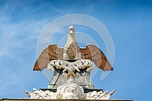 Poznan, Poland - August 09, 2021. Statues on the roof of Kornicka Library - Biblioteka Kornicka in Palac Dzialynskich with protect photo