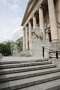 Vertical shot of stairs leading to the entrance of the Grand Theater building in Poznan, Poland