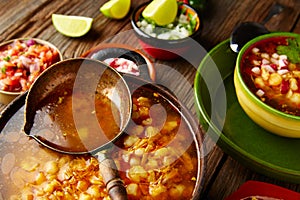 Pozole with mote big corn stew from Mexico in cooking pot photo