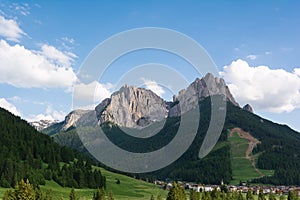 Pozza di Fassa village at the foot of Dolomites, Italy photo