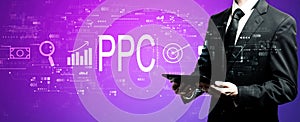 PPC - Pay per click concept with businessman using his tablet