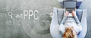 PPC - Pay per click concept with man using a laptop