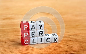 PPC Pay Per Click dices on wood