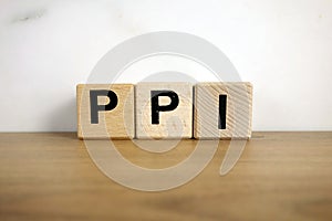 Ppi payment protection insurance abbreviation from wooden blocks