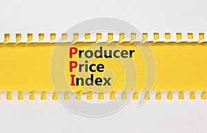 PPI Producer price index symbol. Concept words PPI Producer price index on yellow paper. Beautiful white table white background.