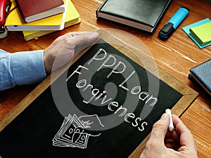 PPP Loan Forgiveness is shown on the conceptual business photo