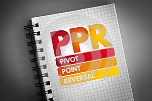 PPR - Pivot Point Reversal acronym on notepad, business concept background