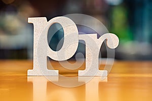 PR Alphabet on Blur Background Public Relations