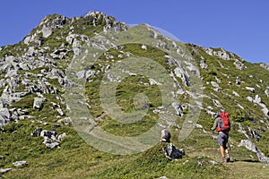 Walkers on mountain paths to the top