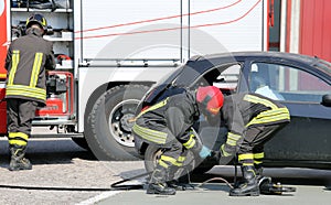 practice of firefighters in the Firehouse with simulation of road accident