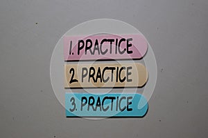 Practice. Practice. Practice write on sticky notes isolated on the tables