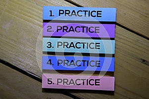 Practice. Practice. Practice text on sticky notes isolated on the tables