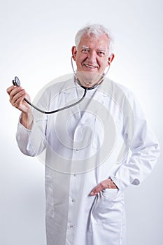 Practiced doctor with stethoscope photo