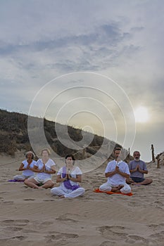 Practicing yoga on the beach