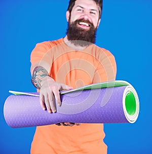 Practicing yoga every day. Man bearded athlete hold fitness mat. Fitness and stretching. Having good stretch. Athlete