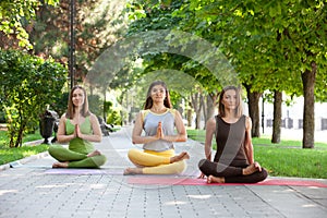 Practicing of yoga outdoors.