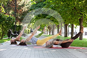 Practicing of yoga outdoors.