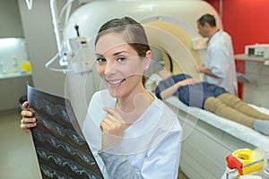 Practitioner holding MRI result