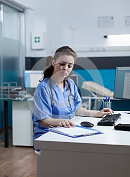 Practitioner nurse with stethoscope analyzing healthcare treatment