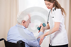 Practitioner showing patient exercise