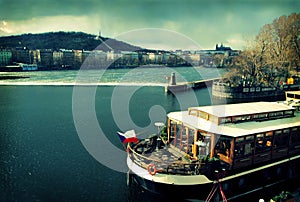 Prague with boat on Vltava river