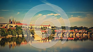 Prague, capital of the Czech Republic. Scenic sunset view of the Old Town pier architecture and Charles Bridge over Vltava river.