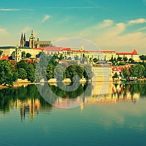 Prague, capital of the Czech Republic. Scenic sunset view of the Old Town pier architecture and Charles Bridge over Vltava river.