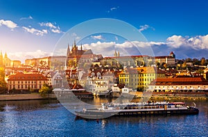 Prague Castle, Charles Bridge and boats on the Vltava river. View of Hradcany Prague Castle, Charles Bridge and a boats on the