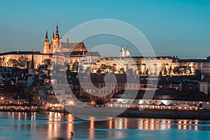 Prague Castle and Charles Bridge in the evening, Prague, Czech Republic, Vltava river in foreground