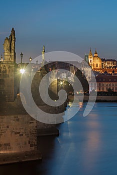 Prague Castle and Charles Bridge in the evening, Prague, Czech Republic, Vltava river in foreground