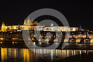 The Prague castle, Charles Bridge and Vltava river in the night scene