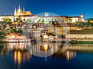 Prague Castle, Czech: Prazsky hrad. Illuminated landmark by night. Vew from Charles Bridge, Praha, Czech Republic