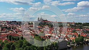 Prague castle scenic spring aerial view of the Prague Old Town pier architecture and Charles Bridge over Vltava river in Prague,